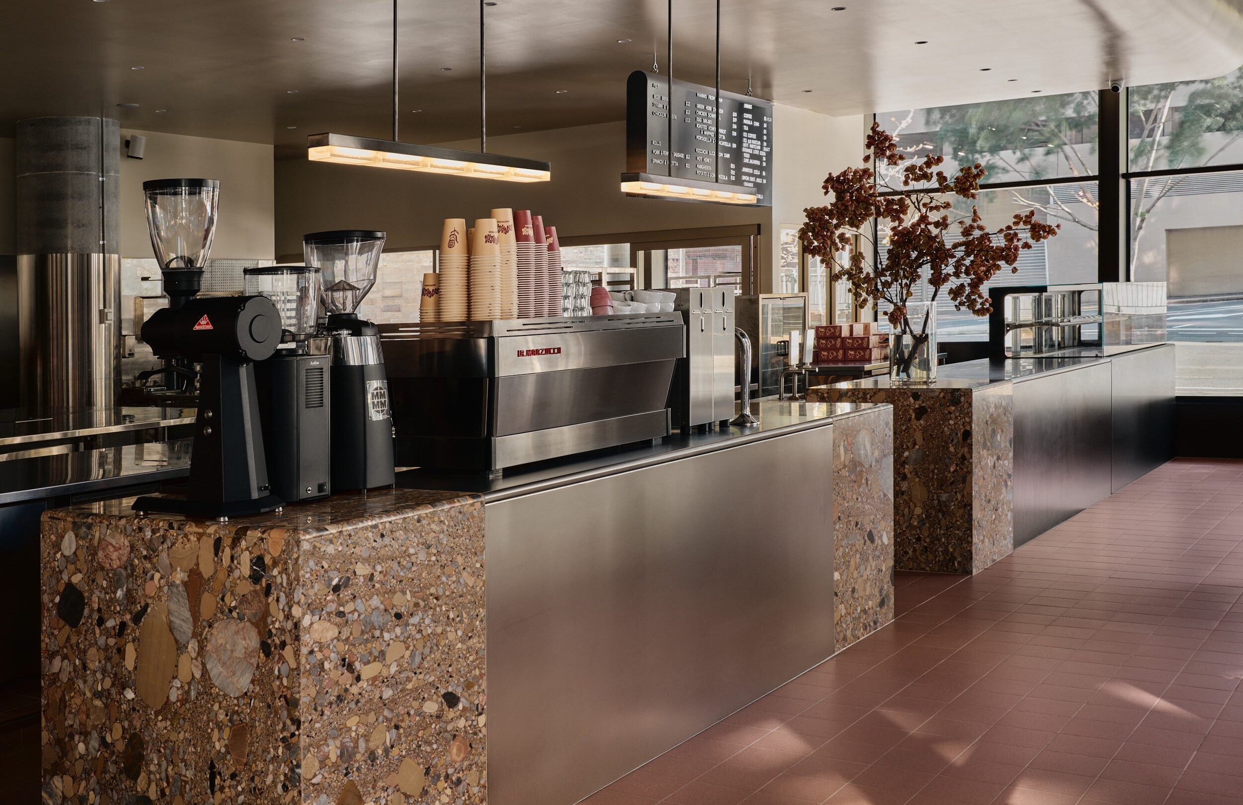 Servery and coffee machines behind the terrazzo counter at Banksia Bakehouse